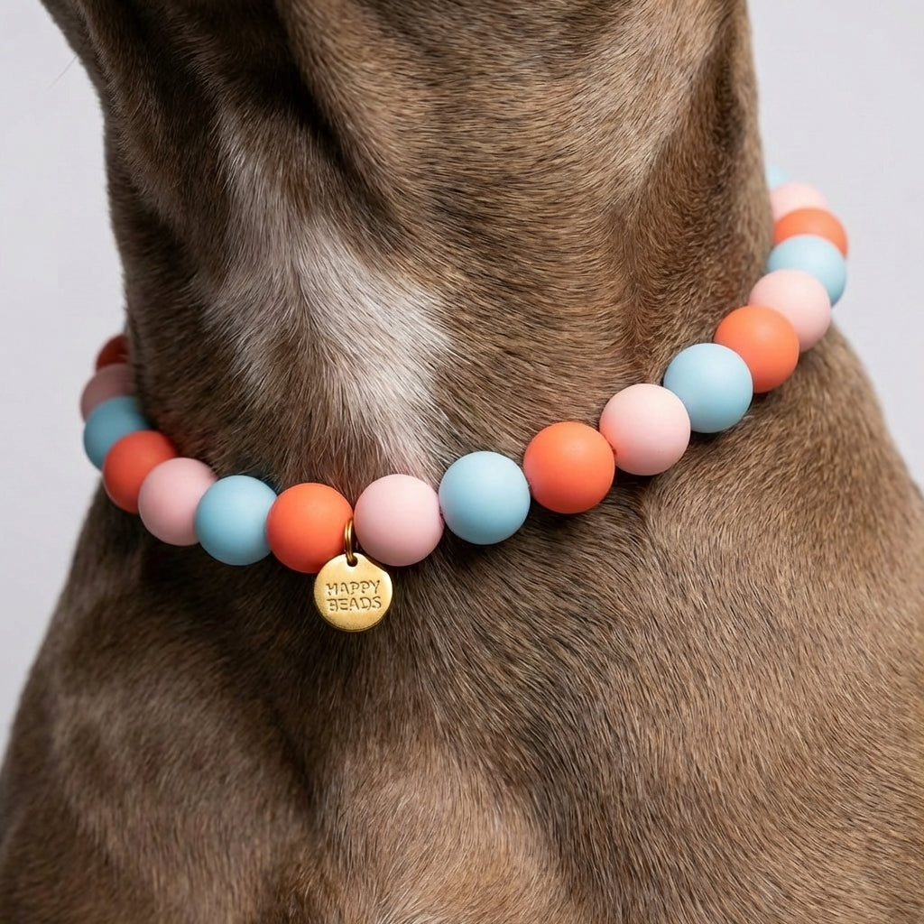 Close-up of Happy Pebble Dog Necklace by Happy Beads featuring colorful handmade silicone beads on a soft dog collar.