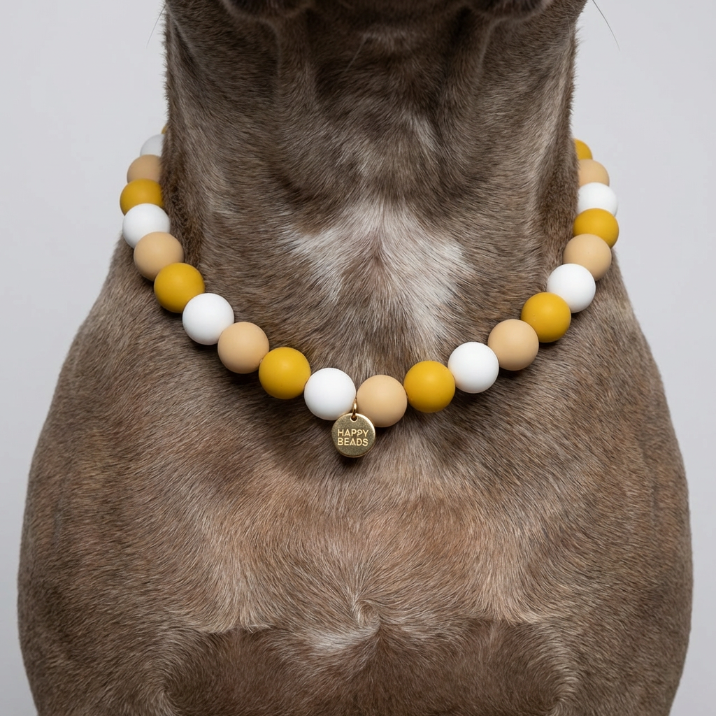 Close-up of a handmade Honey Cream silicone bead dog necklace by Happy Beads showing soft, rounded beads on a white background.